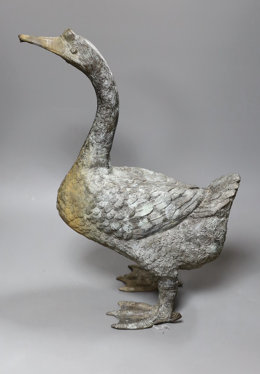 A weathered bronze garden fountain modelled as a goose, 46cm